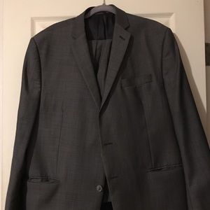 Grey 2 piece suit. Pants is sized 40W x 32L